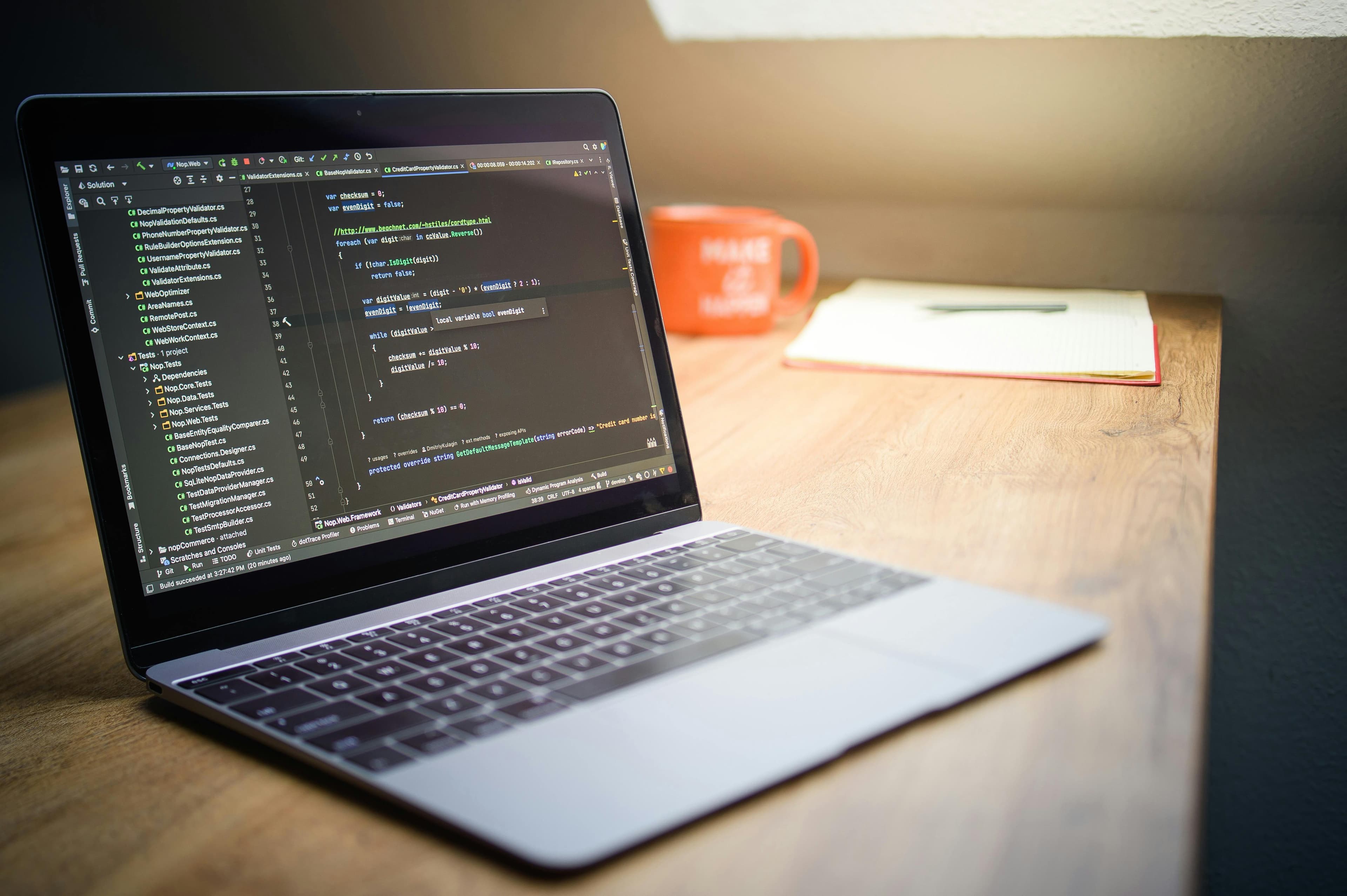 Laptop workspace showing code during a website build.